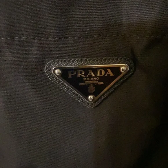 It’s a large Prada button up short sleeve black good Material